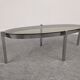 Oval smoked glass coffee table from the 60s/70s