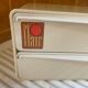 Bakelite white plastic vintage wall storage box with Flair origin label