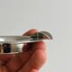 Small ashtray in shiny silver metal
