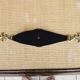 Old armrest ashtray with fleur-de-lis design in leather and brass.
