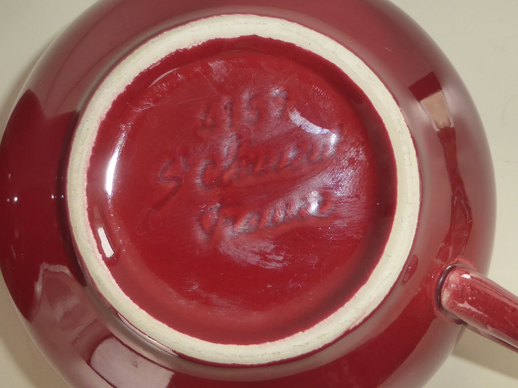 2 Old bowls with ox blood colored handle in St Clément earthenware