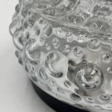 Molded glass ceiling light with spinning top relief