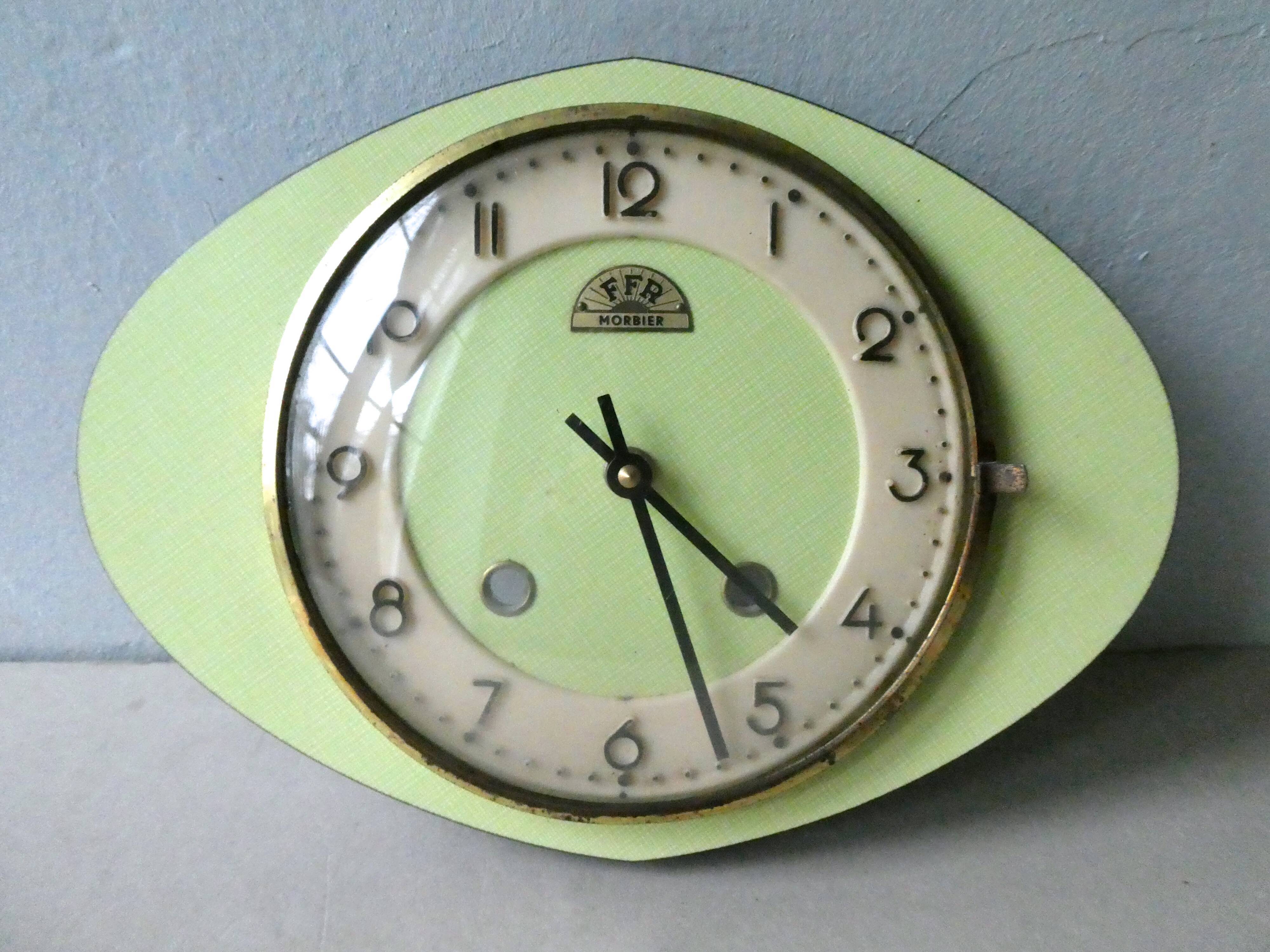 Pendulum wall clock FFR in formica green of the 1960s