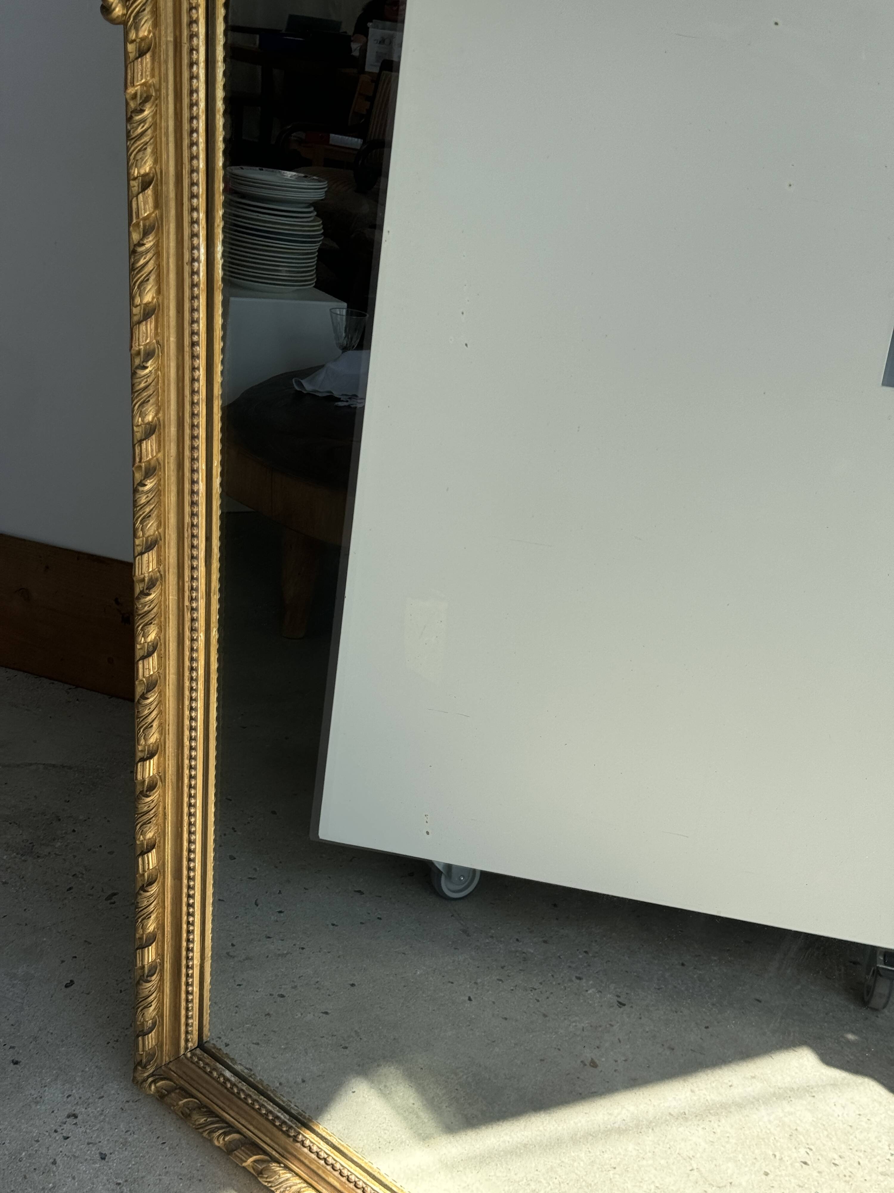 Large gilded mirror with acanthus leaf pediment H150 L98