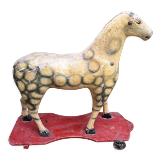 Antique toy, wooden horse on wooden base with wheels, dating from 1900