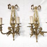 Pair of antique bronze wall lights. Louis style candlestick lamps.