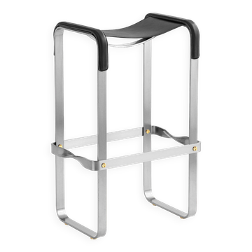 Contemporary classic bar stool in aged silver steel and black leather.