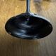 Varnished black metal candlestick