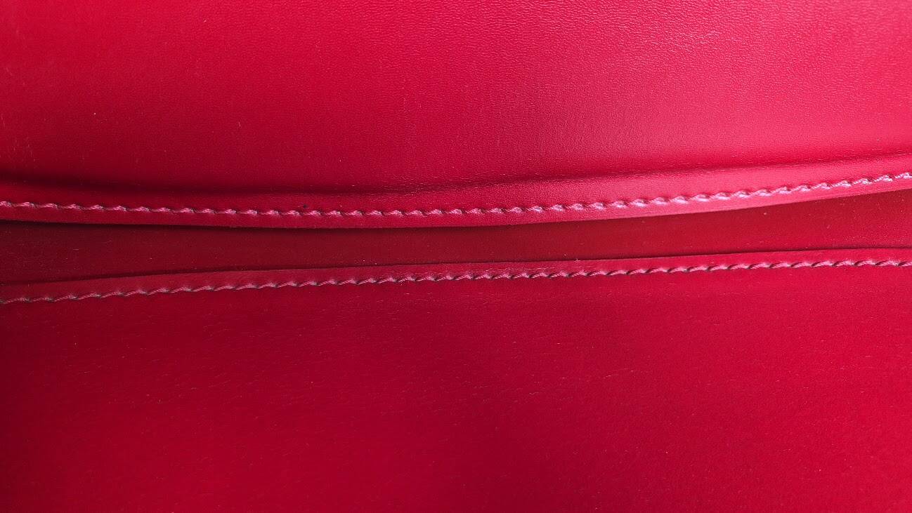 Red leather chairs by Arper