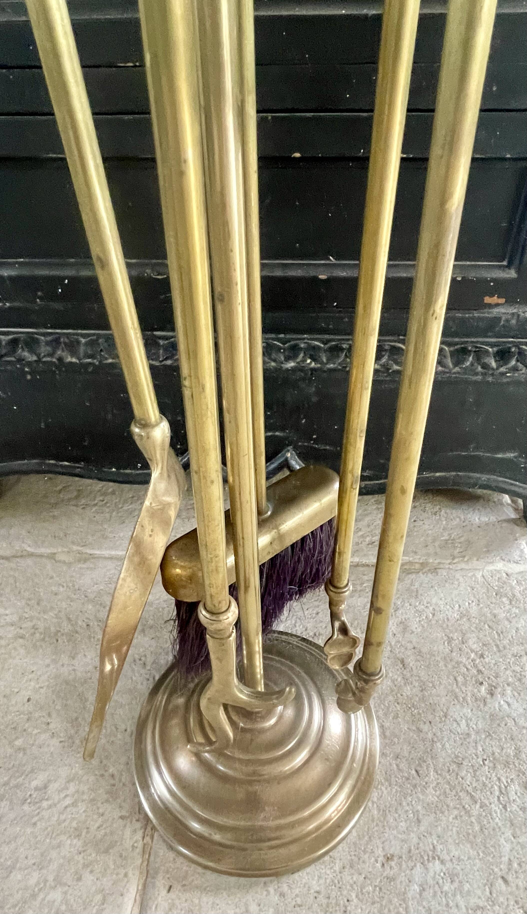 Brass fireplace accessory set with vintage stand