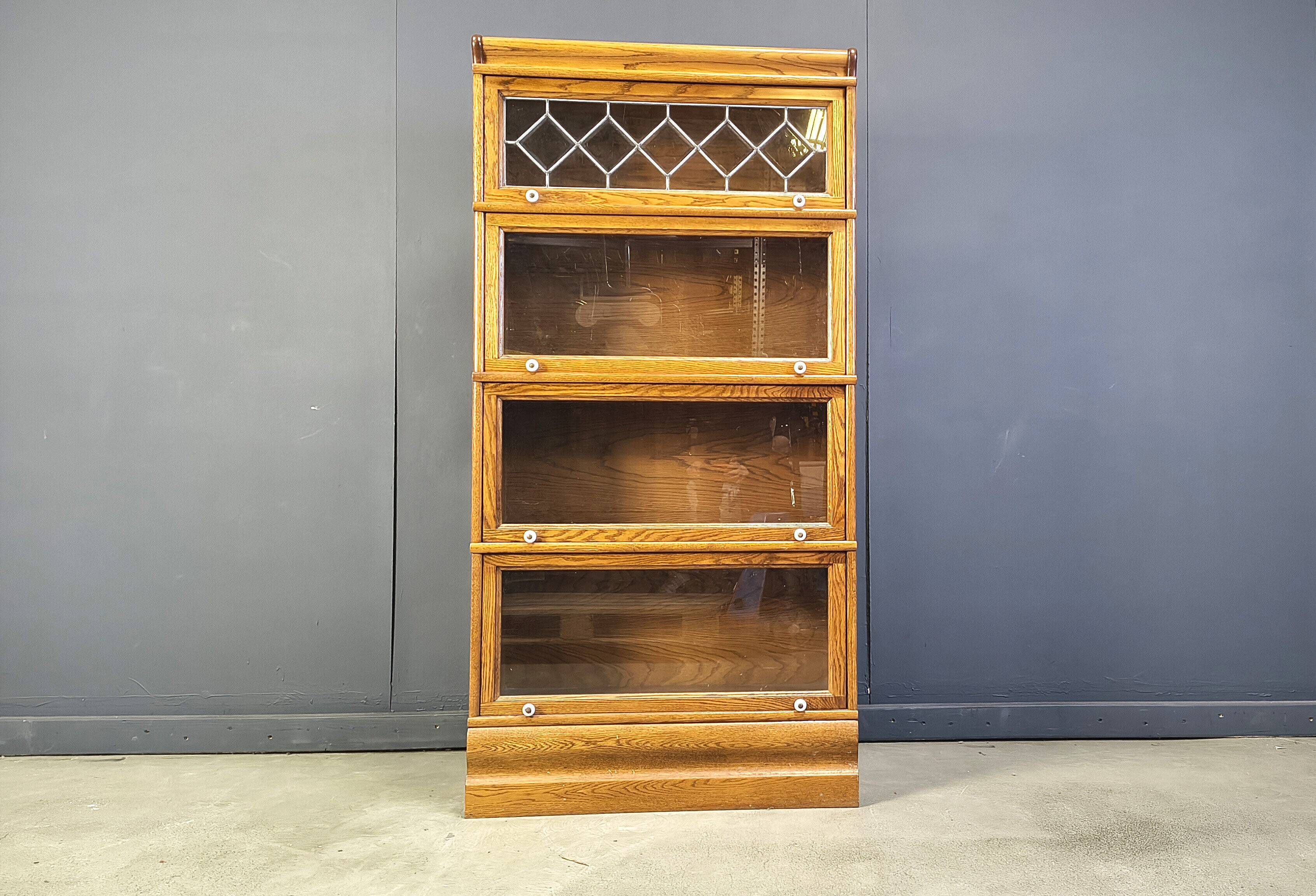 Four tier oak barrister style bookcase with leaded glass