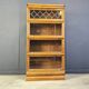 Four tier oak barrister style bookcase with leaded glass