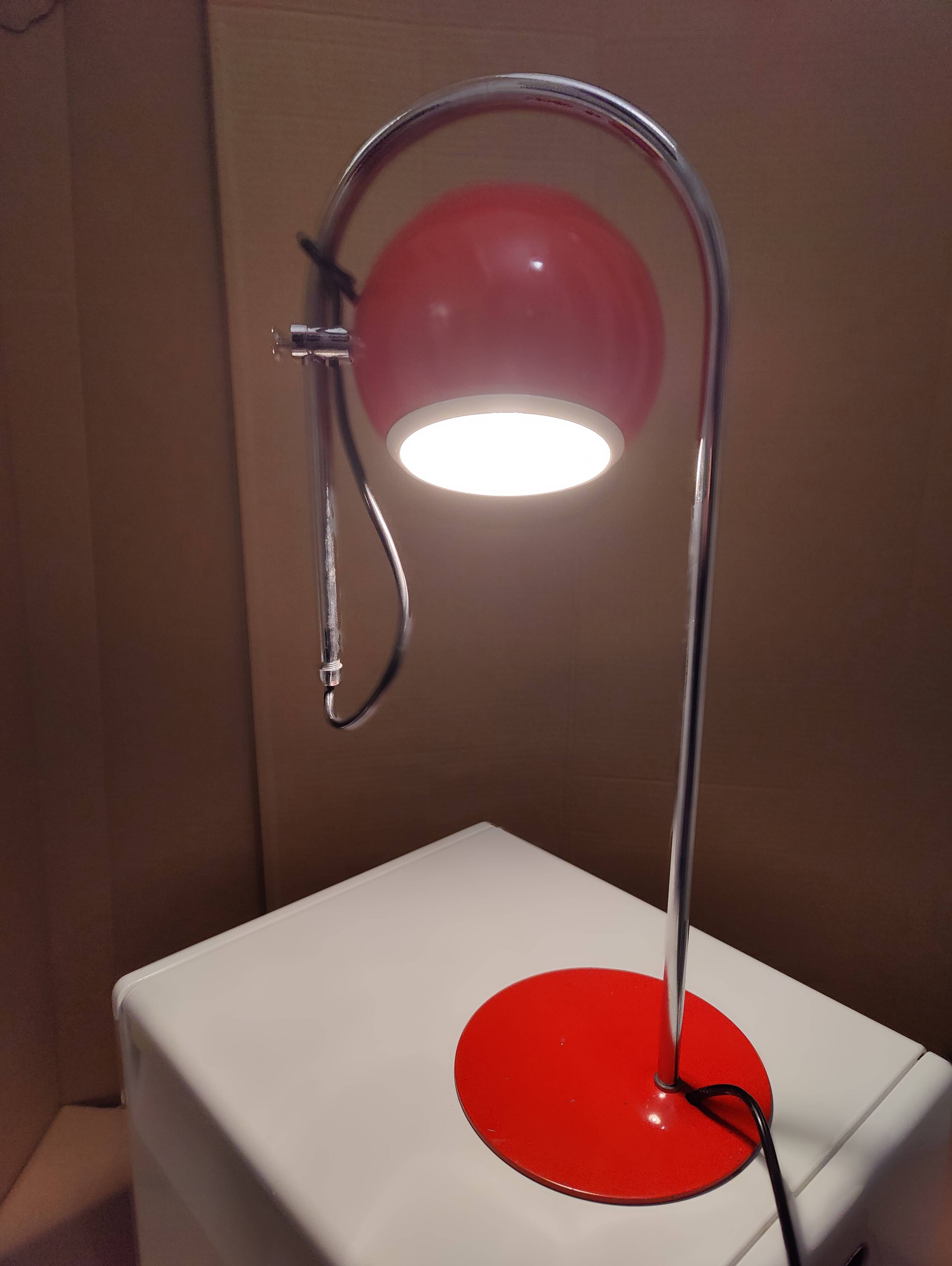 Eyeball space age orange desk or bedside lamp on an arc base