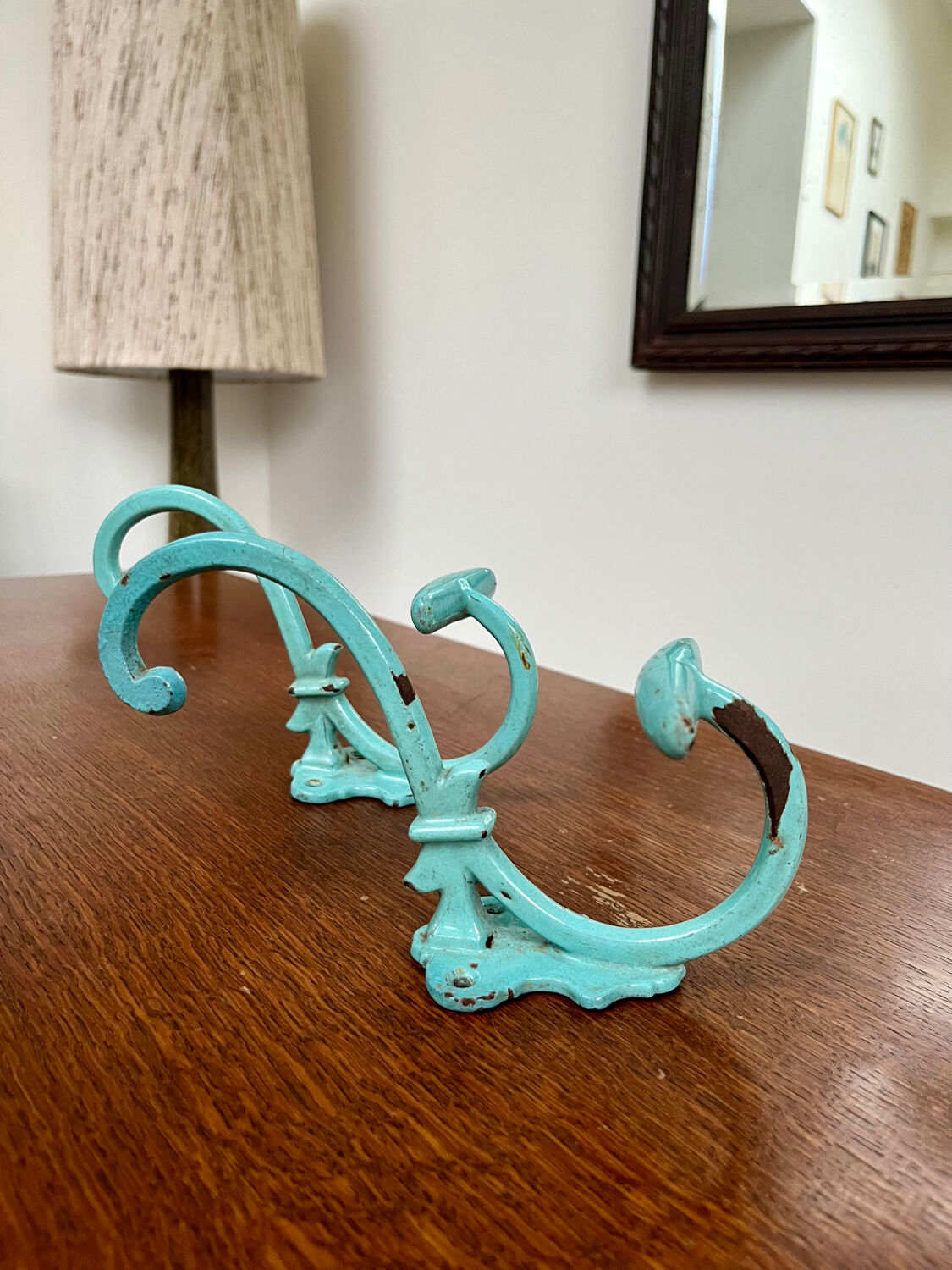 Pair of painted metal wall hooks