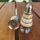 Antique salt and pepper shakers in mother-of-pearl.
