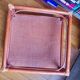 Varnished rattan coffee table and smoked glass top