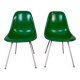 Eames Herman Miller chairs in green fiberglass.