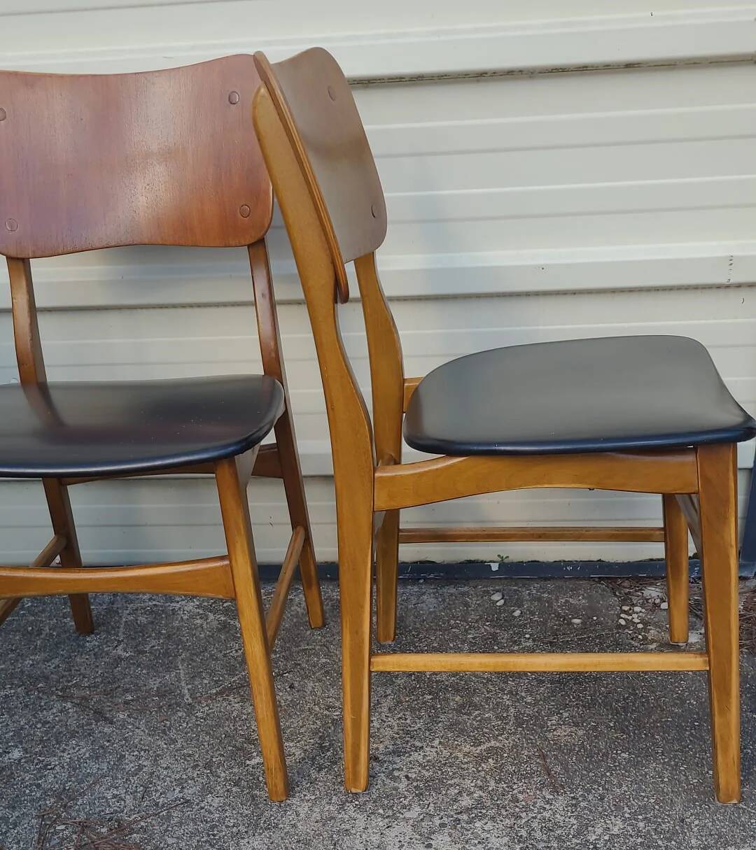 Set of 2 vintage Scandinavian chairs in teak and black faux leather by Kofod-Larsen, Denmark, 1960s.