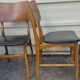 Set of 2 vintage Scandinavian chairs in teak and black faux leather by Kofod-Larsen, Denmark, 1960s.
