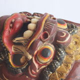 Two polychrome painted and gold leaf gilded Barong dance masks from Bali, Indonesia.