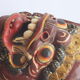Two polychrome painted and gold leaf gilded Barong dance masks from Bali, Indonesia.