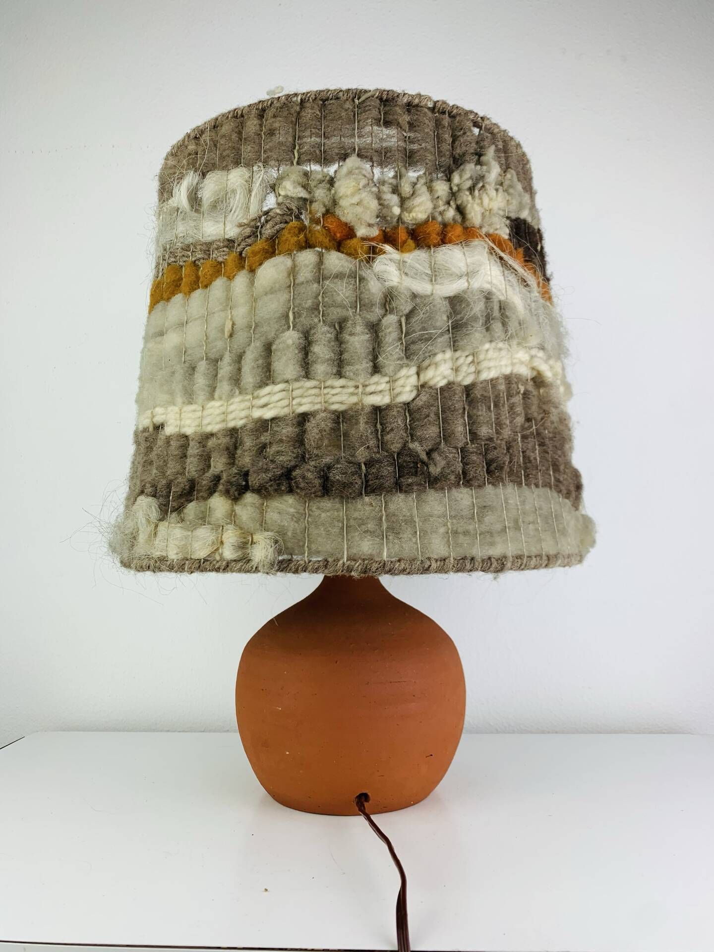 Terracotta globe lamp with a wool shade from the 1960s.