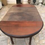 Oval table with extensions in massive mahogany napoleon III era.
