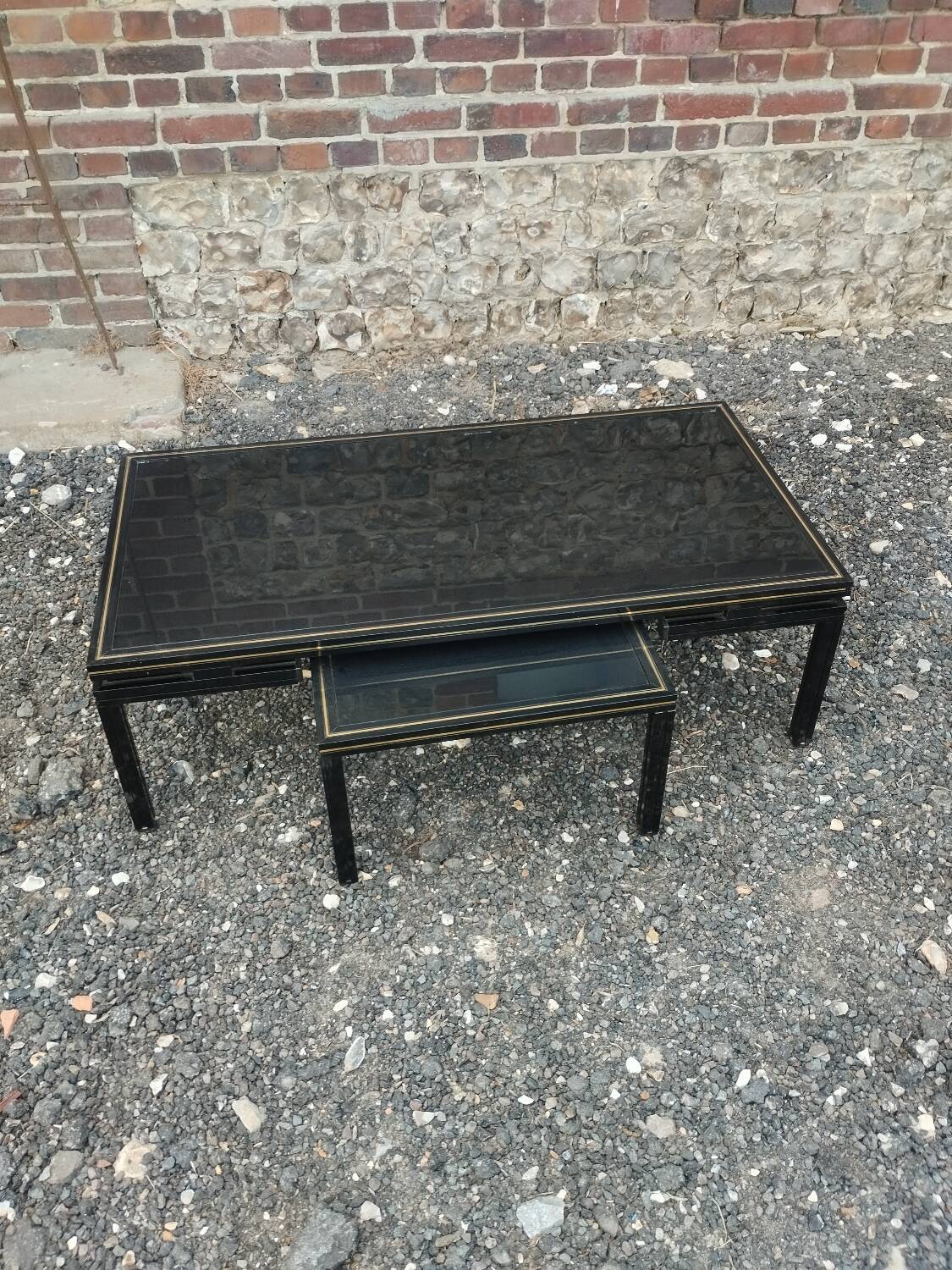 Vintage metal coffee table with glass top.