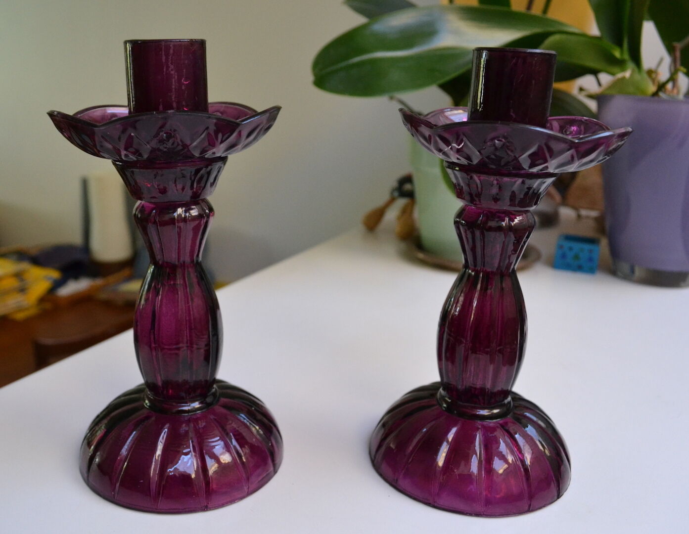 Pair of purple glass candlesticks