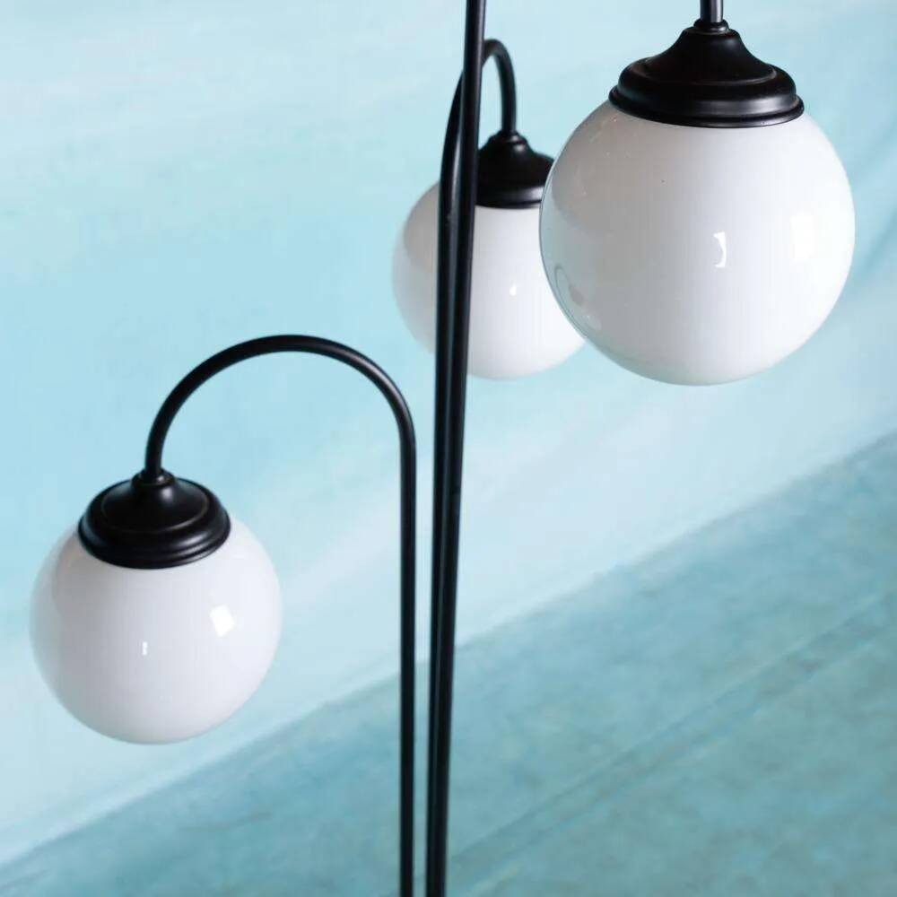 Minimalist floor lamp in glass, space age style.