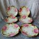Series of 6 plates in slip decorated with roses