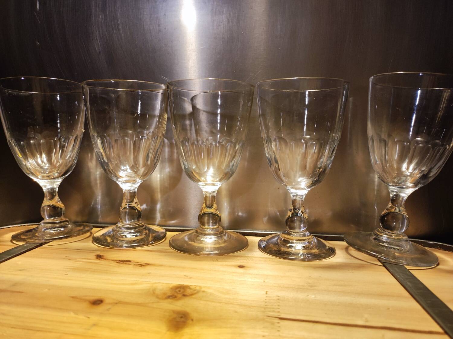 5 antique wine glasses with cut sides