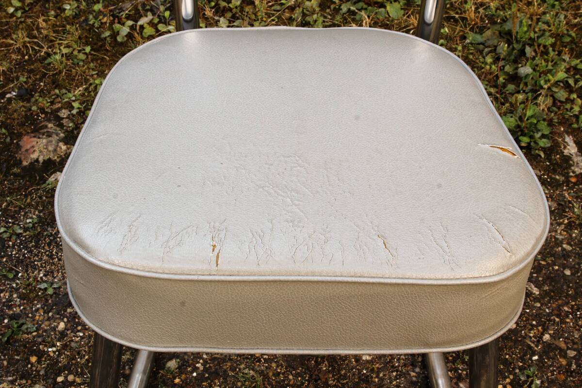 Set of 2 chairs and 1 armchair from the 70s in chrome metal and faux leather.