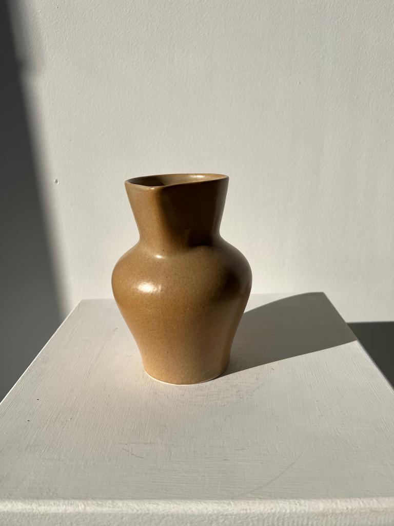Small pitcher in light beige sandstone