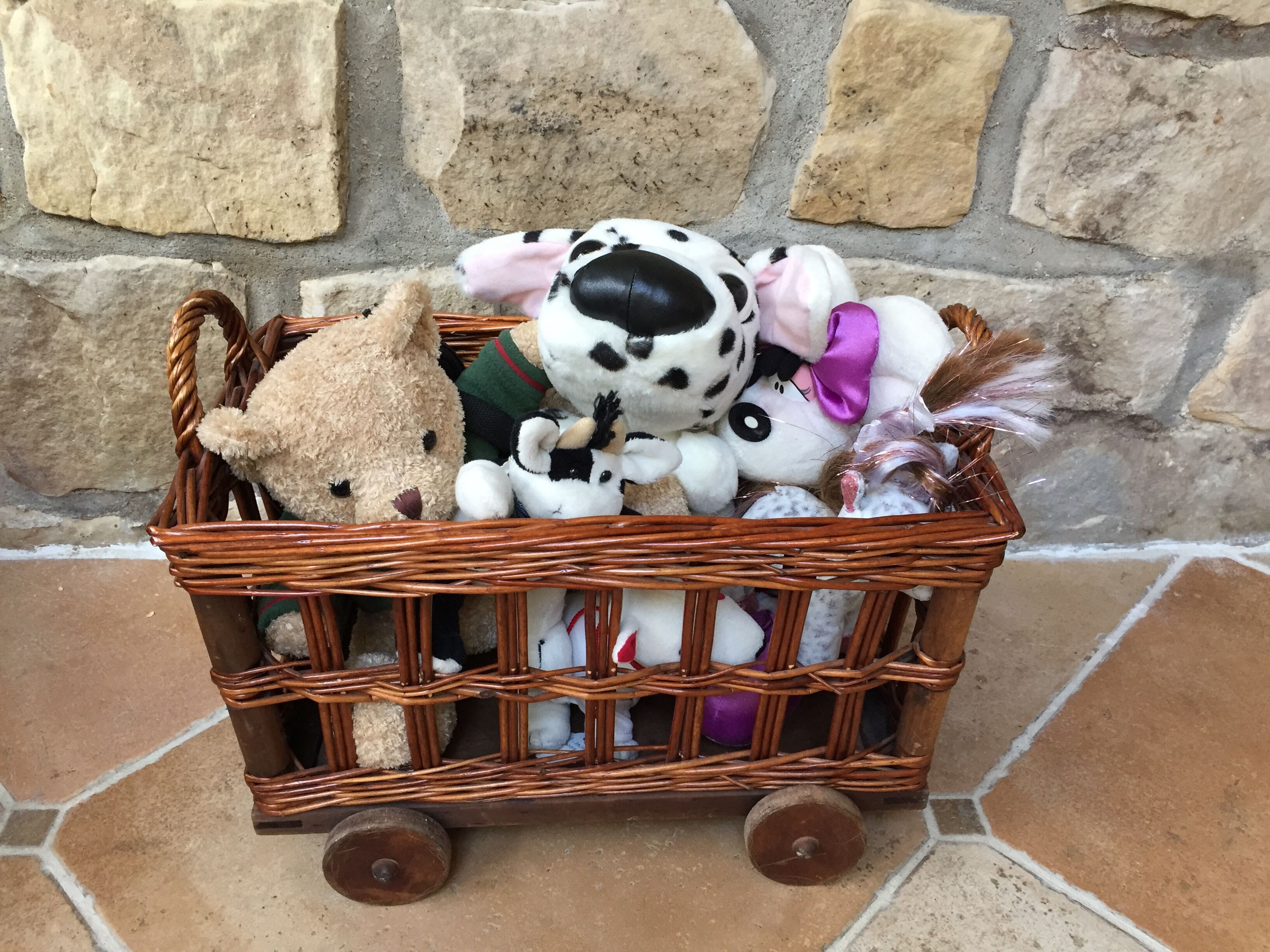 Small wicker wheeled cart