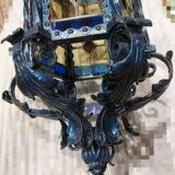 Large antique wrought iron lantern with stained glass windows