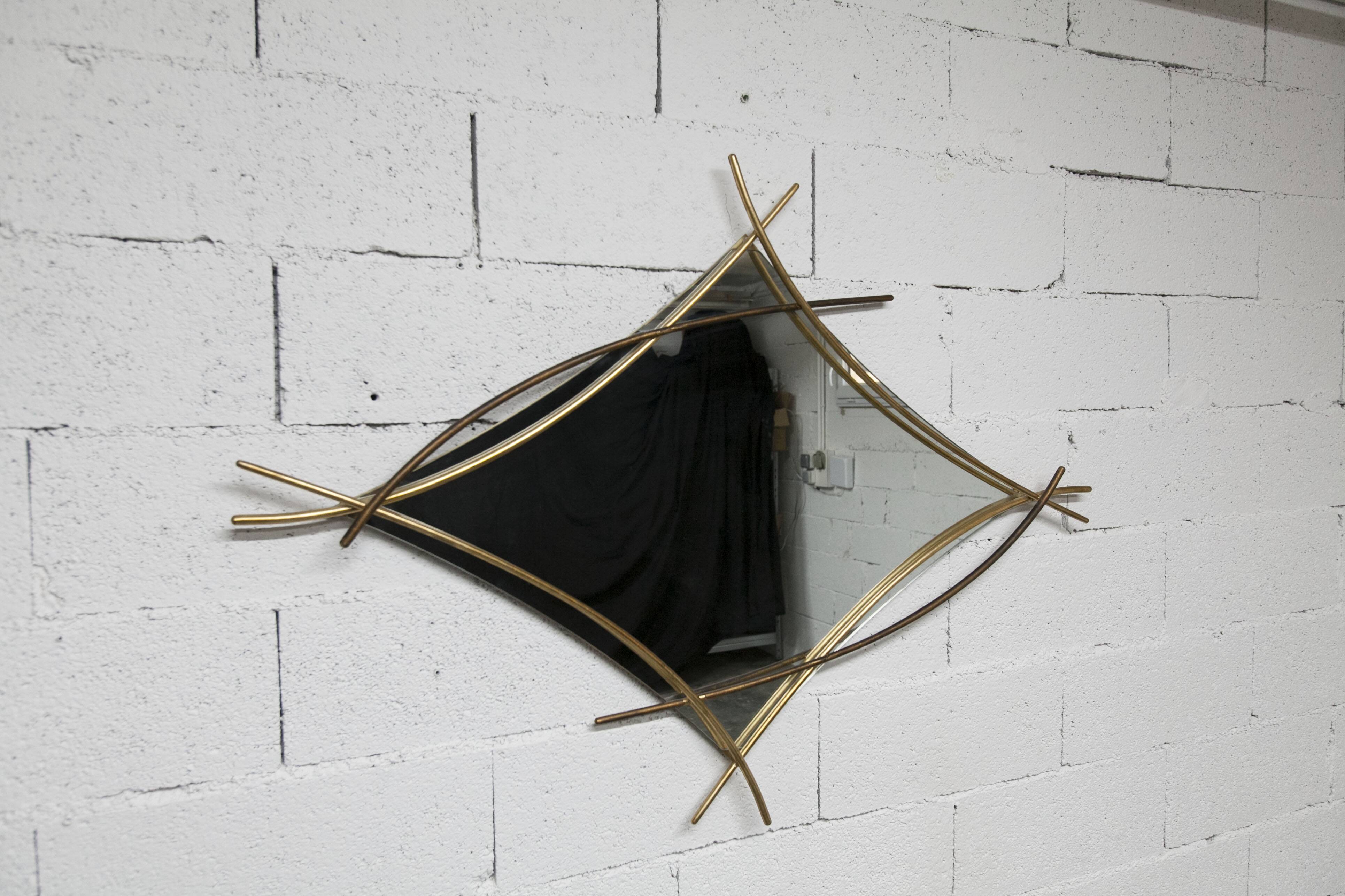 Sculptural mirror with two-tone gilded arches, France, 1970s, 95 x 133 cm