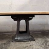 Industrial table with oak top and cast iron central leg