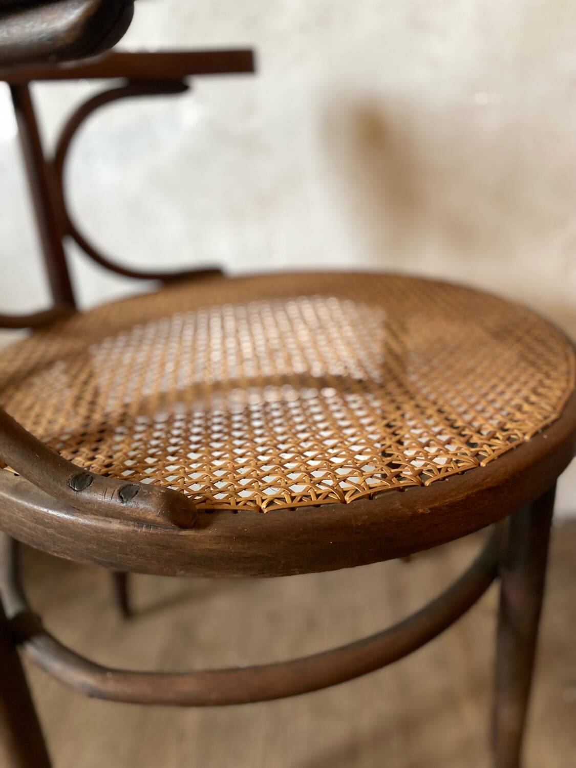 Cane and curved wood armchair