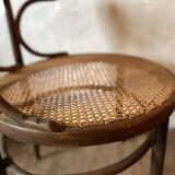 Cane and curved wood armchair