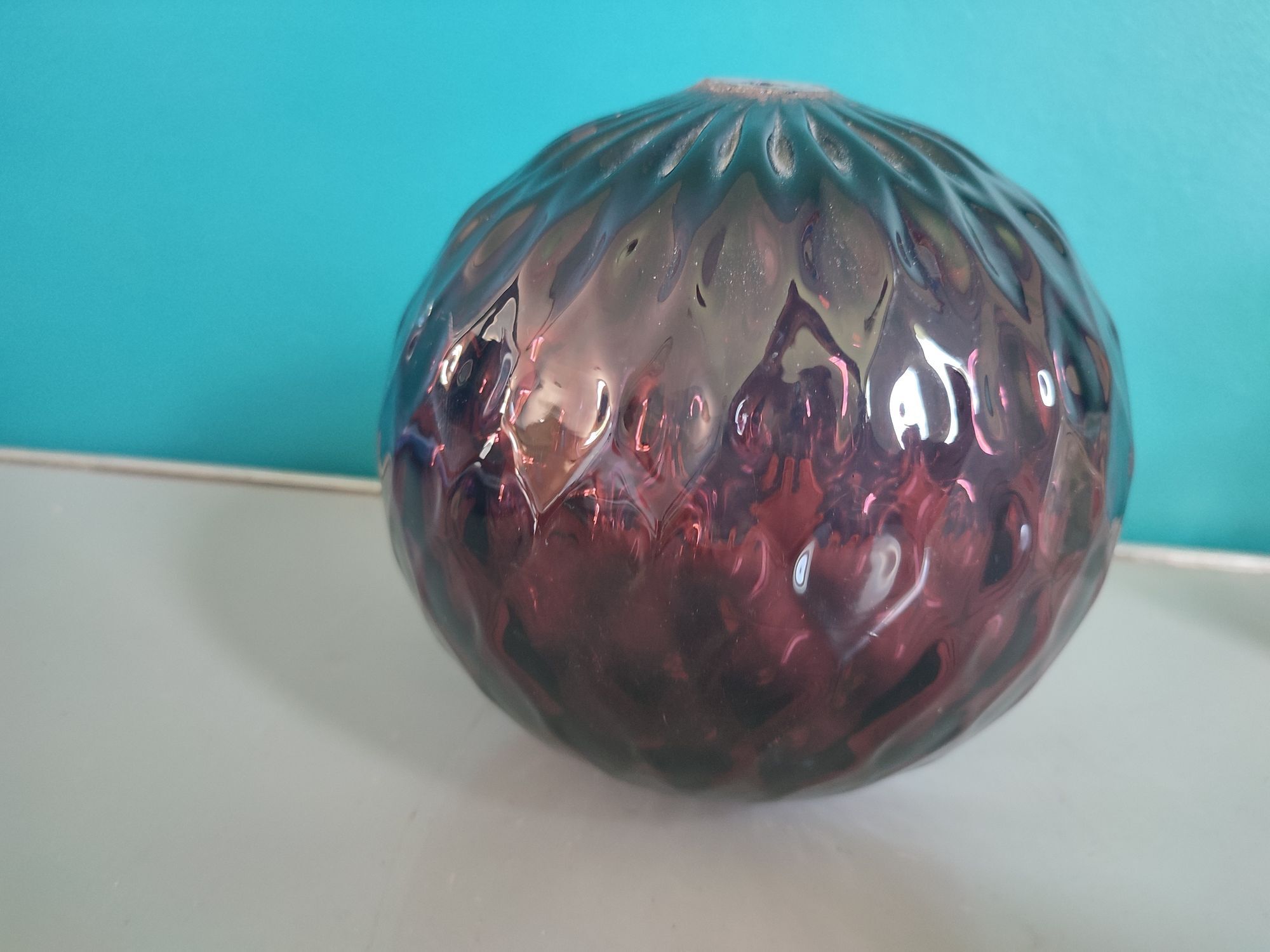 Old plum color blown glass ball