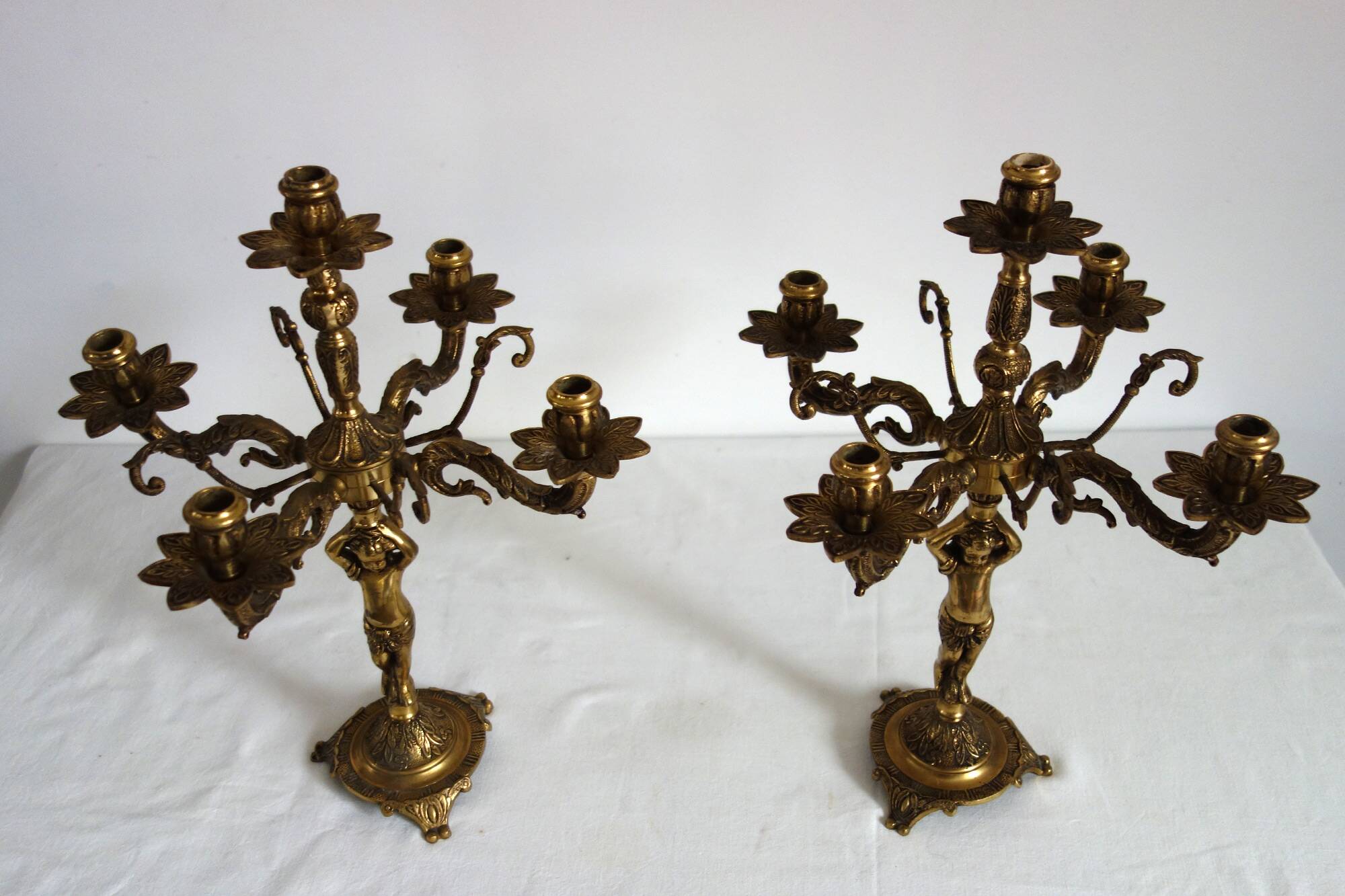 Pair of cherub candlesticks in gilded bronze early 20th century