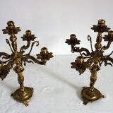 Pair of cherub candlesticks in gilded bronze early 20th century