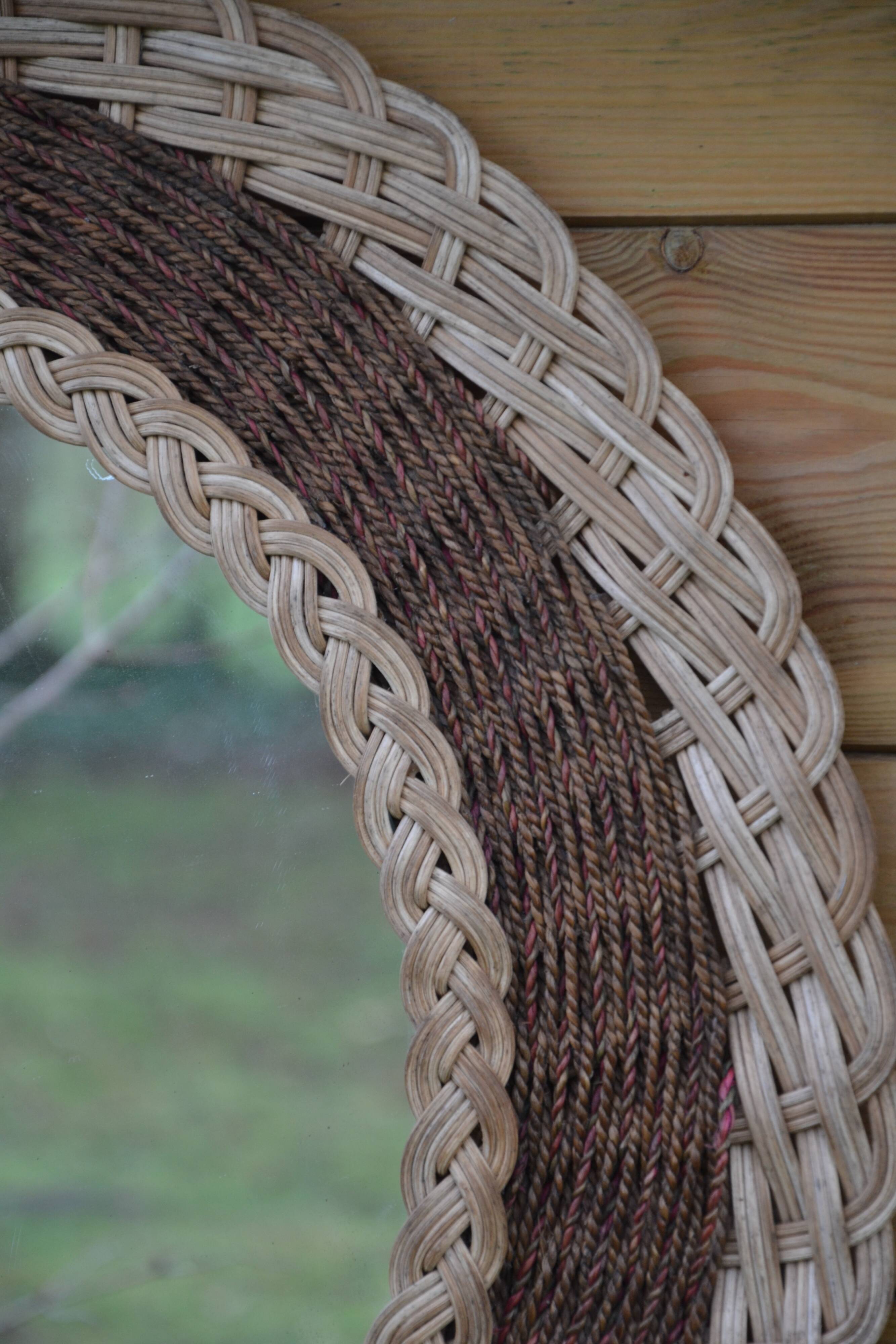 Round woven rattan mirror with rope from the 1970s.
