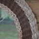 Round woven rattan mirror with rope from the 1970s.