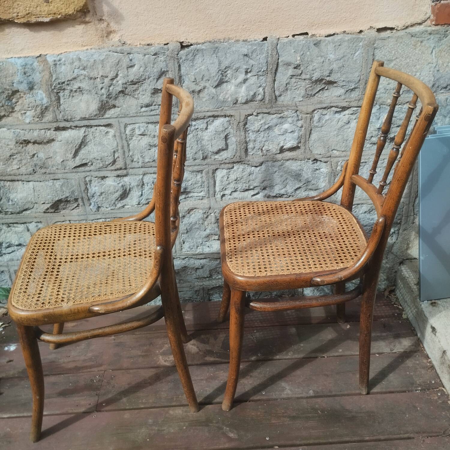 Set of 2 antique bistro chairs. Curved and turned wood.