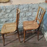 Set of 2 antique bistro chairs. Curved and turned wood.