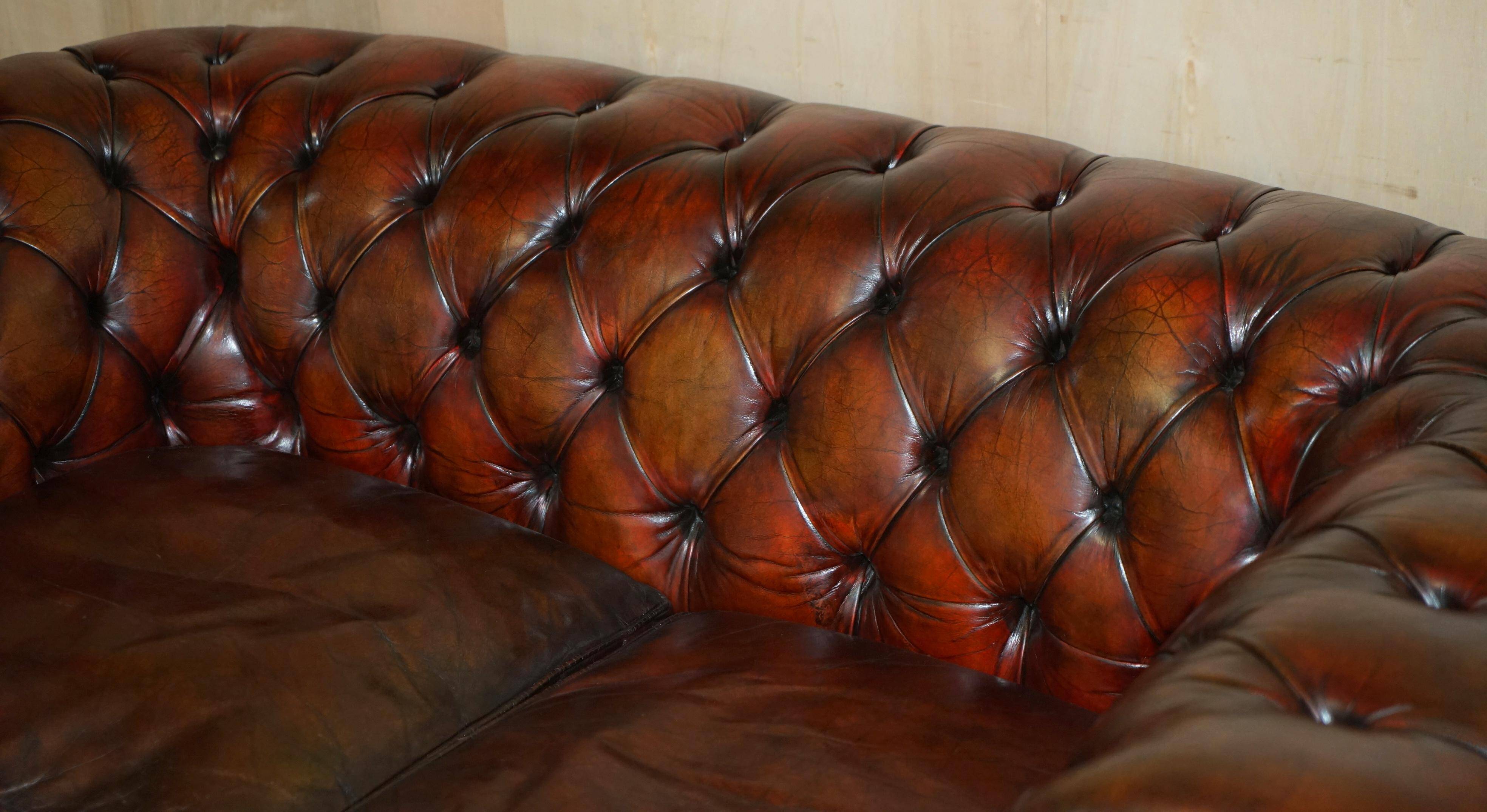 Pair of restored antique Chesterfield sofas in Boudreaux leather.