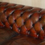 Pair of restored antique Chesterfield sofas in Boudreaux leather.