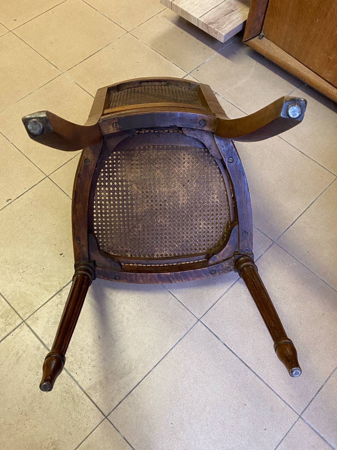 Chair with caned seat and back made of wood